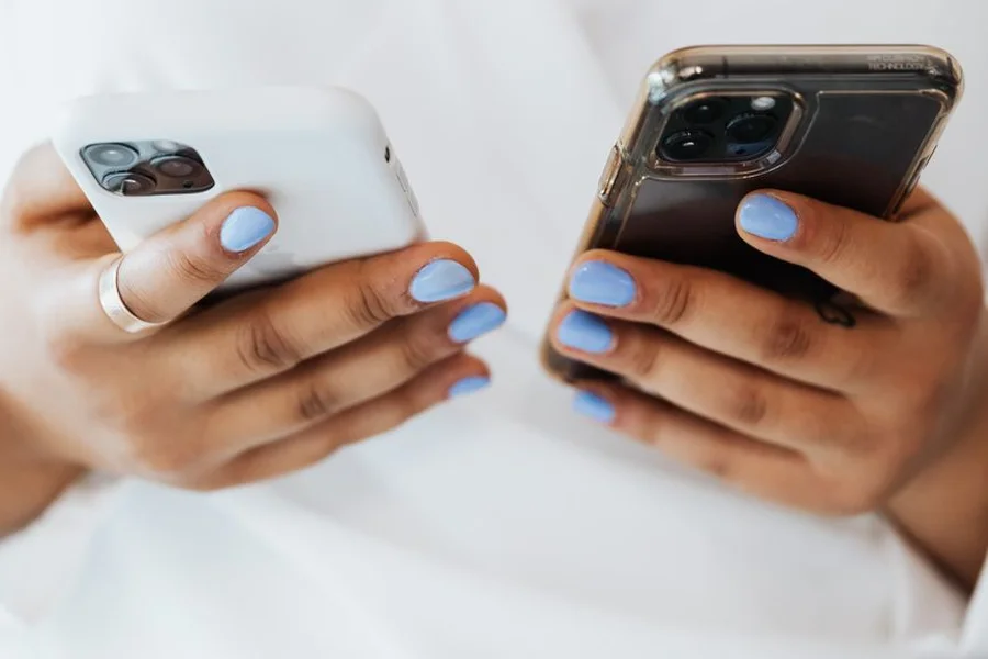 User holding an Android smartphone while adjusting animation settings in developer options